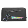 dragon hair cutting scissor and black straight razor lying on black leather pouch